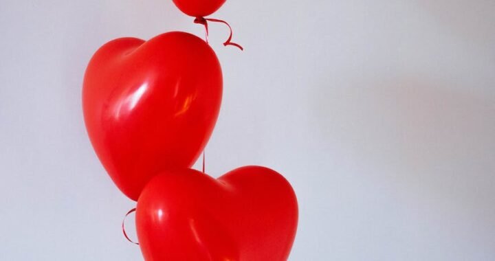 three red heart balloons